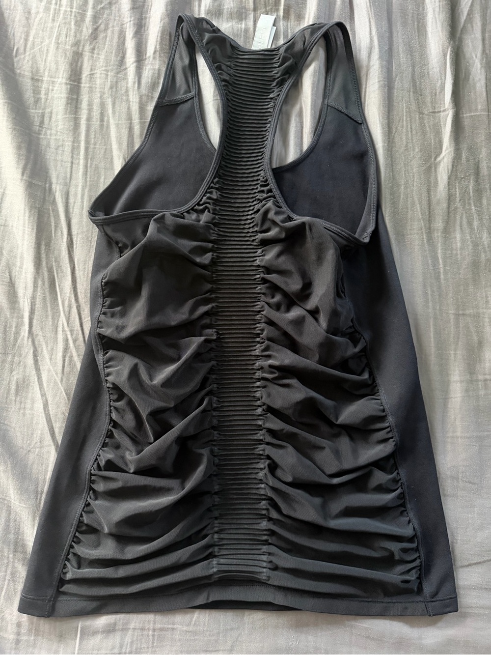 Athleta black ruched back racerback top.
